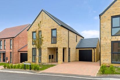 Modern brick home with driveway and garage in at a new-build development in Essex.