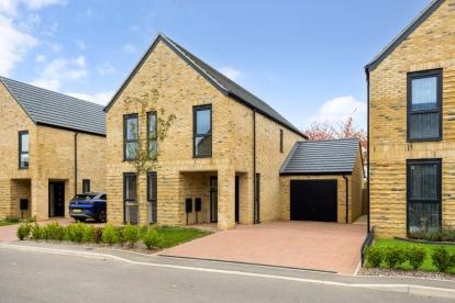 Modern brick home with driveway and garage in at a new-build development in Essex.
