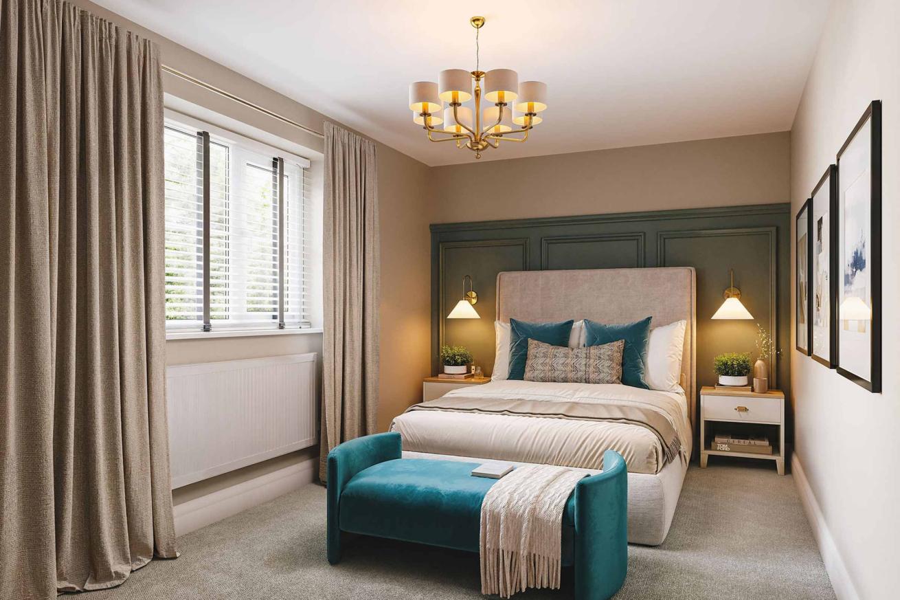 Stylish bedroom with a teal bench, upholstered bed, and dark green panelled feature wall.