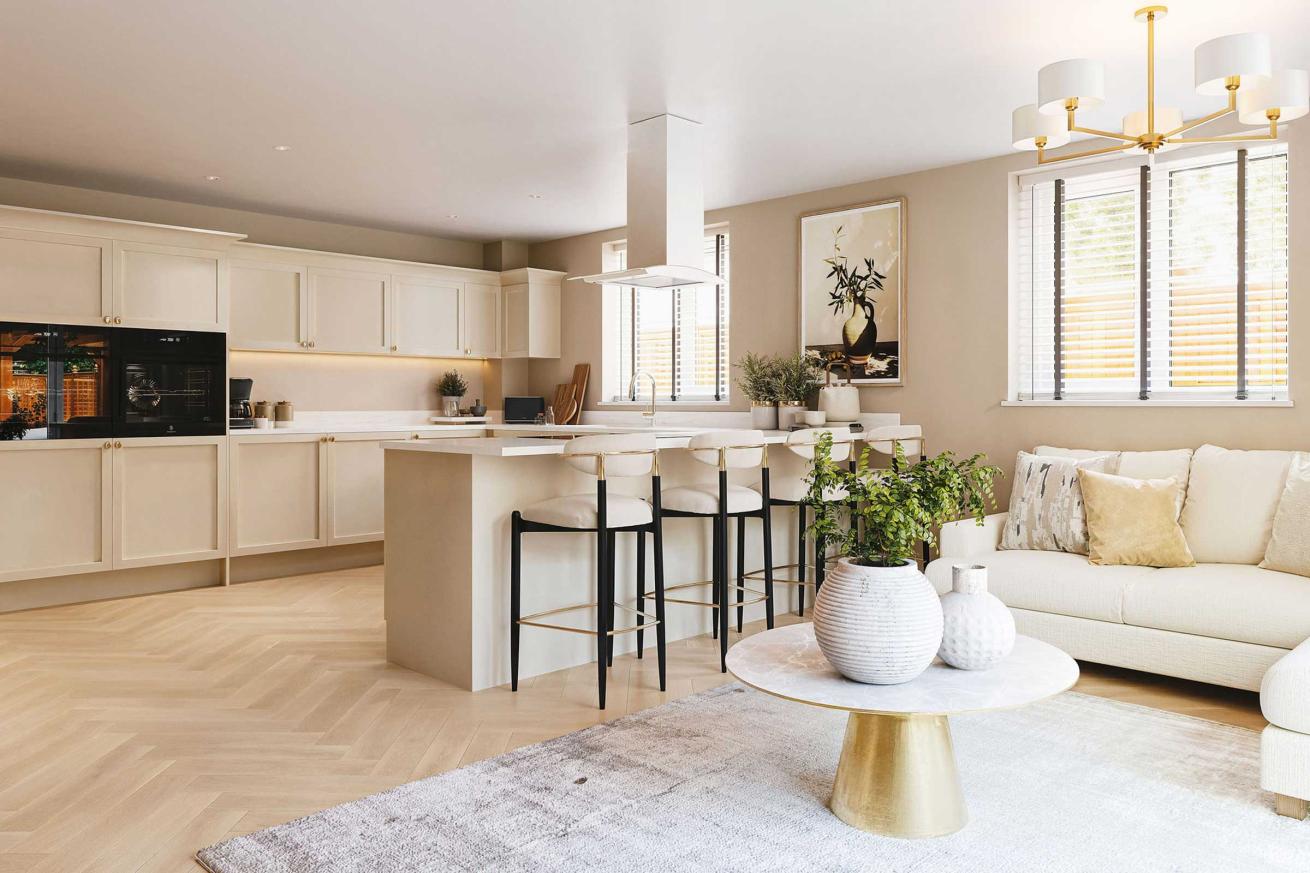  Contemporary kitchen and living space with cream cabinets, a breakfast bar with three stools, a white sofa, a round coffee table with decorative vases, and large windows allowing natural light to fill the room.